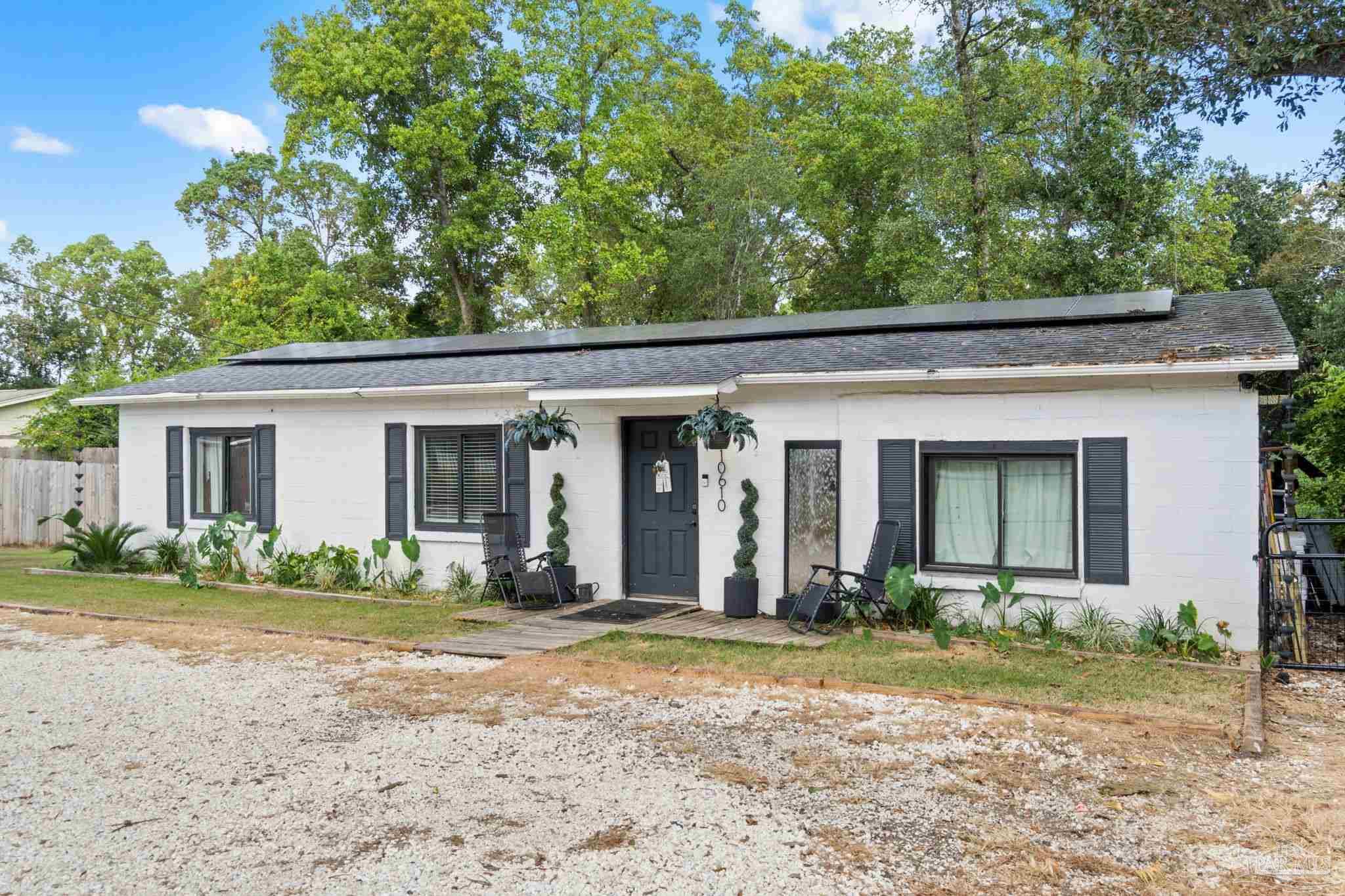 10610 Chemstrand Road Pensacola, FL 32514 - Photo 3 of 42 a front view of a house with garden