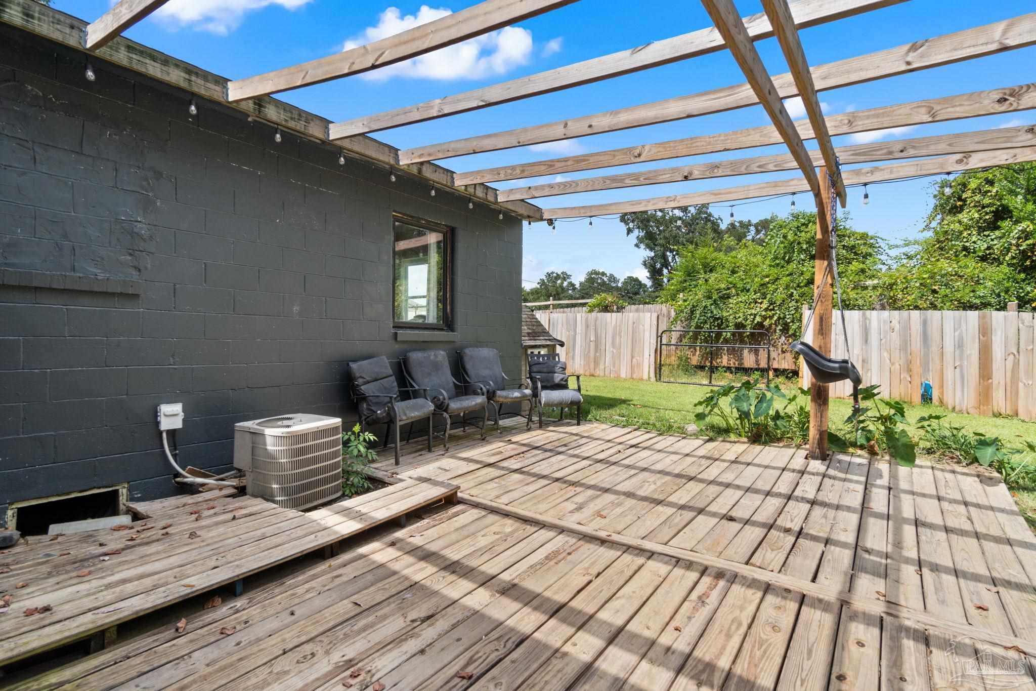 10610 Chemstrand Road Pensacola, FL 32514 - Photo 31 of 42 a backyard of a house with seating space