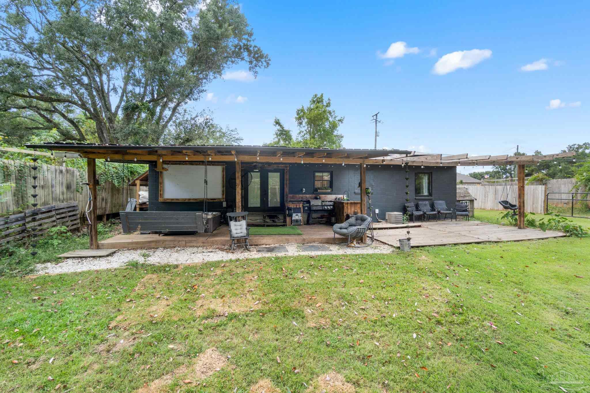 10610 Chemstrand Road Pensacola, FL 32514 - Photo 35 of 42 a view of a house with sitting area and furniture
