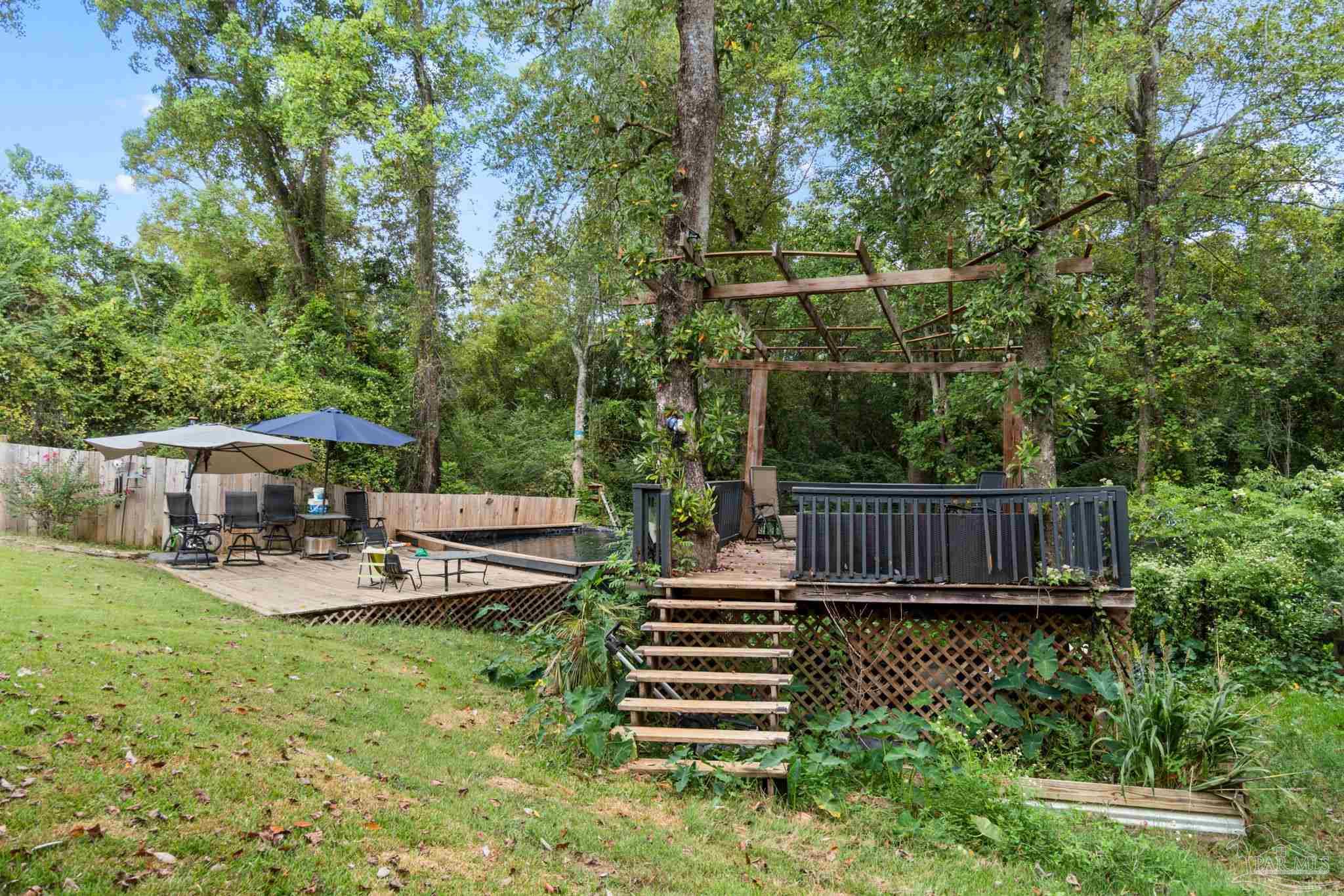 10610 Chemstrand Road Pensacola, FL 32514 - Photo 39 of 42 a view of a chair and table in the garden