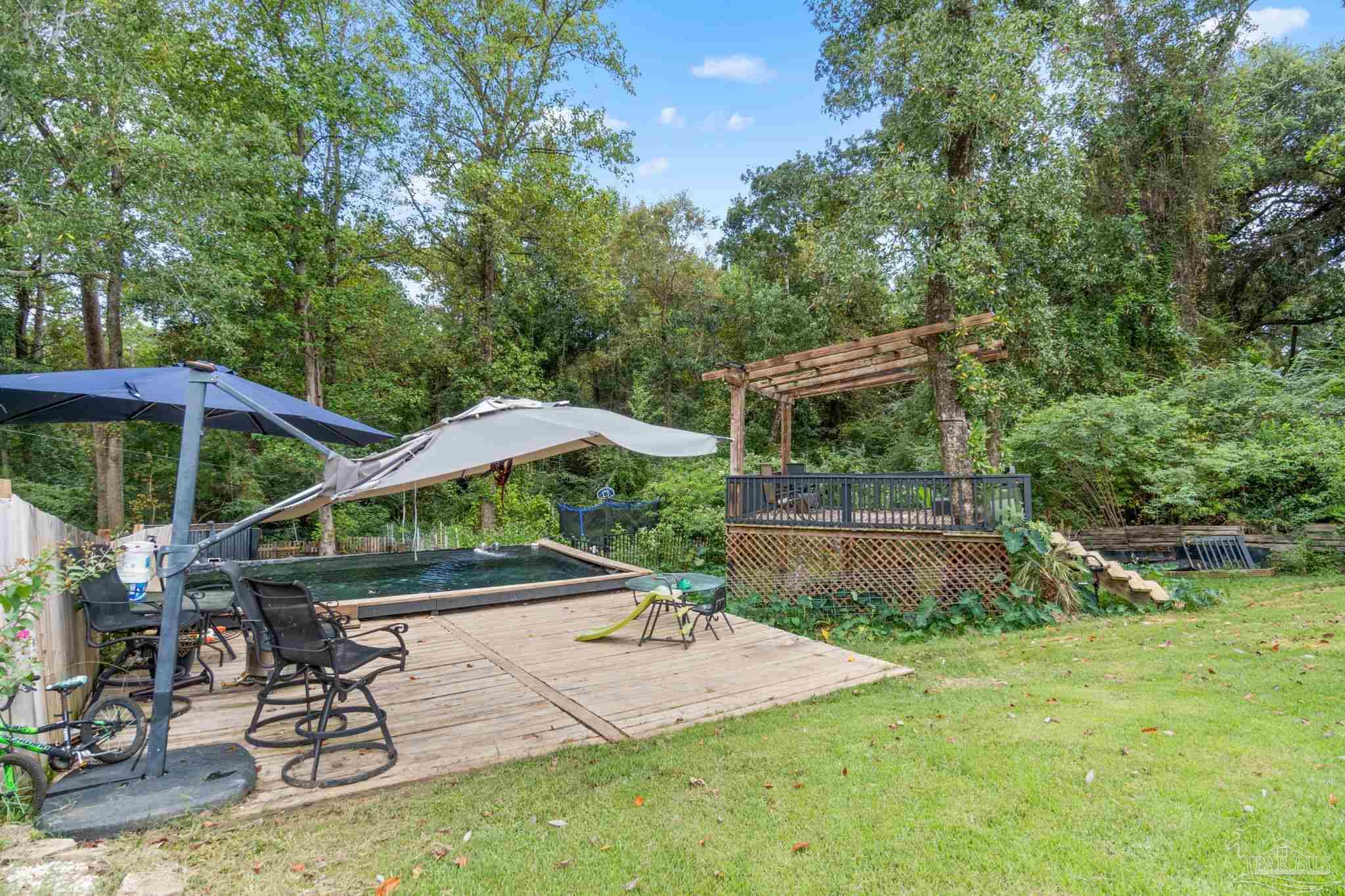 10610 Chemstrand Road Pensacola, FL 32514 - Photo 41 of 42 a view of a backyard with sitting area