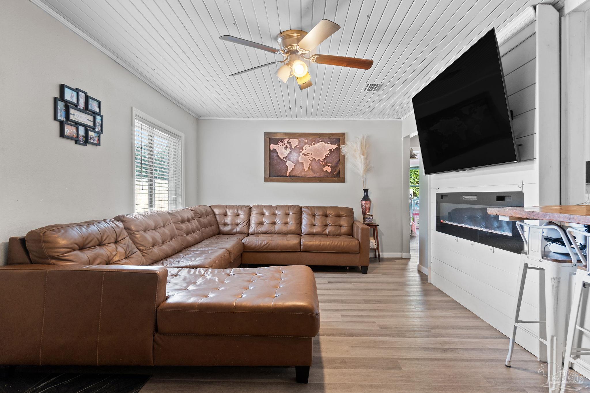 10610 Chemstrand Road Pensacola, FL 32514 - Photo 6 of 42 a living room with furniture and a flat screen tv