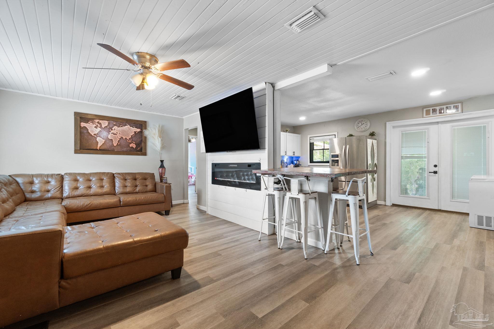 10610 Chemstrand Road Pensacola, FL 32514 - Photo 7 of 42 a living room with furniture and a flat screen tv