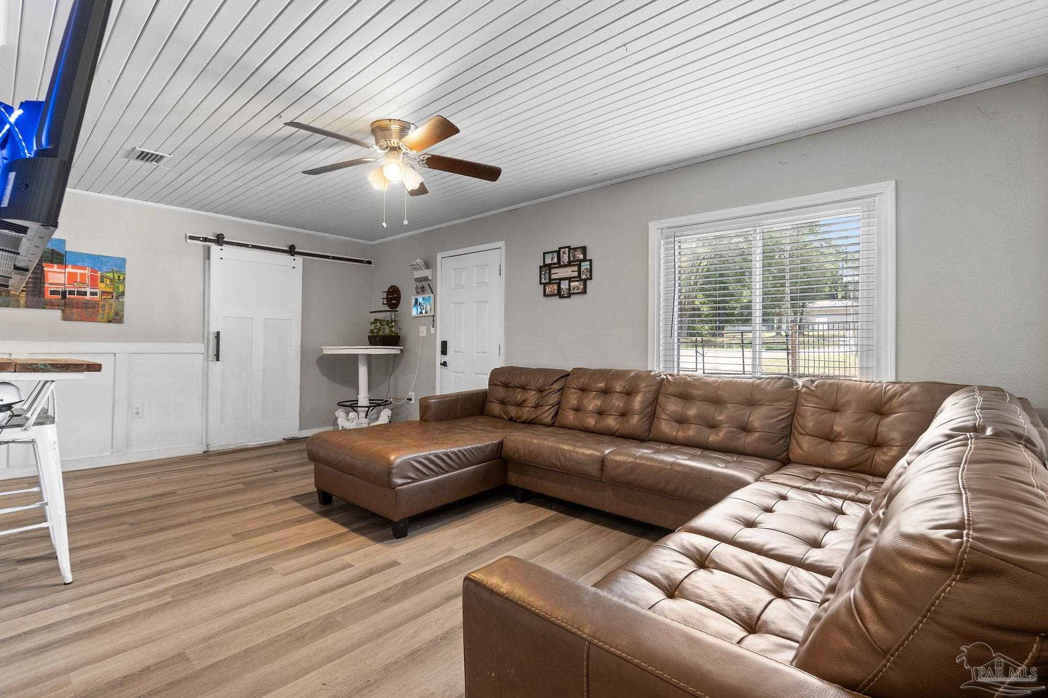 10610 Chemstrand Road Pensacola, FL 32514 - Photo 8 of 42 a living room with furniture and a large window