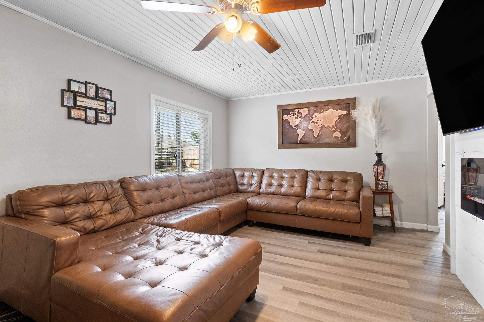 10610 Chemstrand Road Pensacola, FL 32514 - Photo 9 of 42 a living room with furniture and a flat screen tv