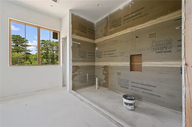 a bathroom with a tub and shower