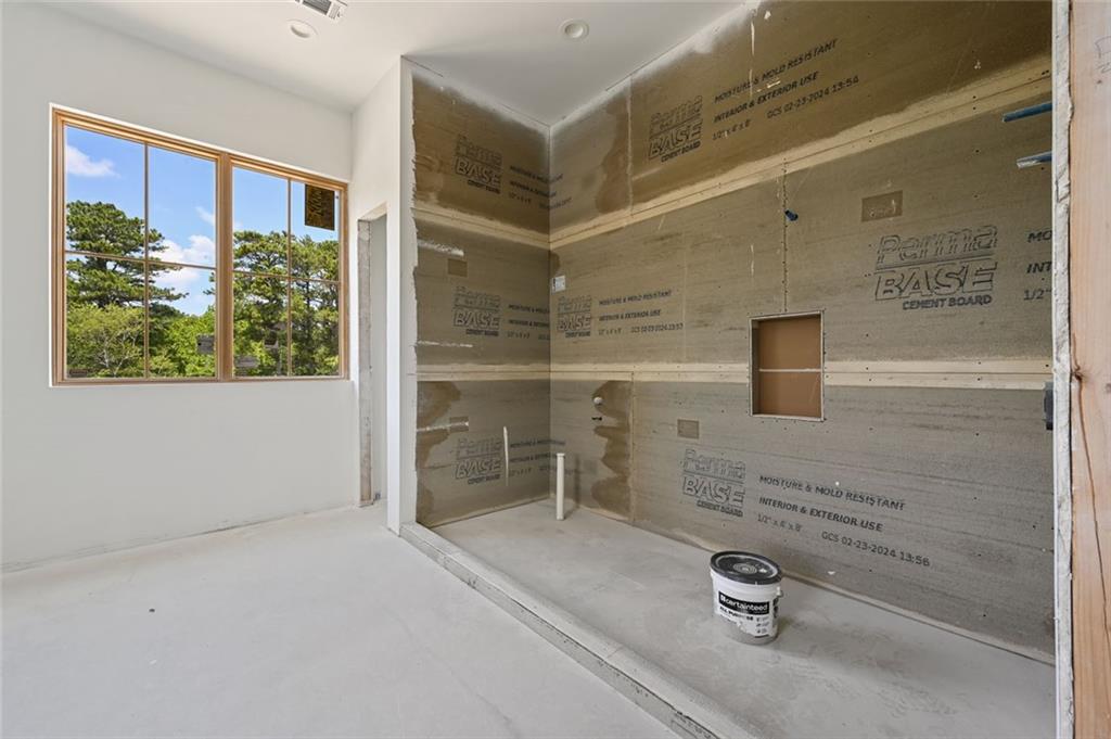 8200 Main Street, Unit 1306 Woodstock, GA 30188 - Photo 13 of 43 a bathroom with a tub and shower