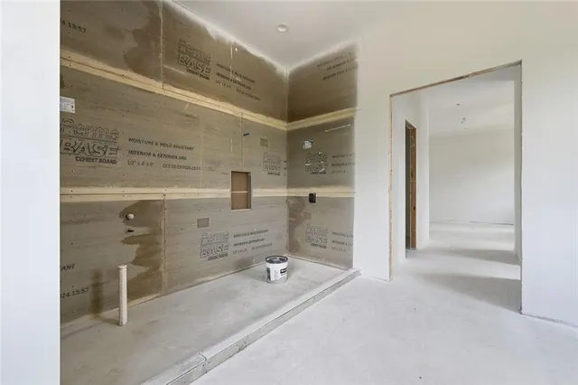 a bathroom with a tub and shower