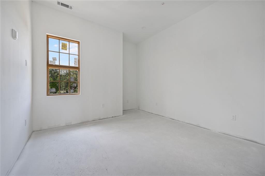 8200 Main Street, Unit 1306 Woodstock, GA 30188 - Photo 16 of 43 an empty room with windows