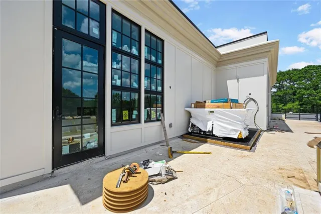 a view of a lounge chair in the patio of the house