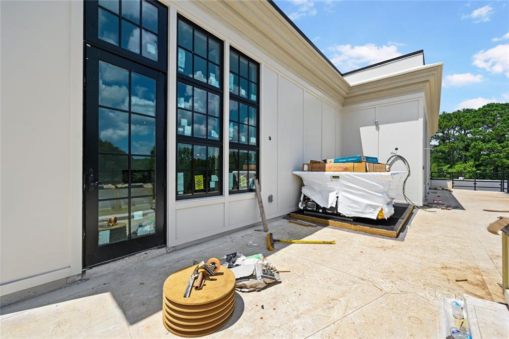 8200 Main Street, Unit 1306 Woodstock, GA 30188 - Photo 24 of 43 a backyard of a house with dining table and chairs