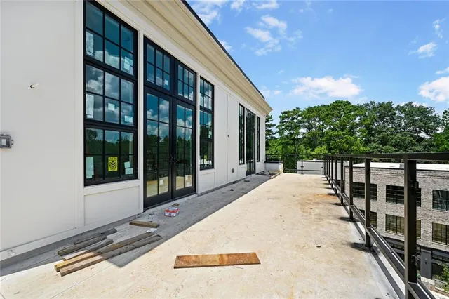 a wooden bench sitting in front of a building