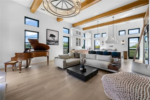 a large kitchen with a table and chairs