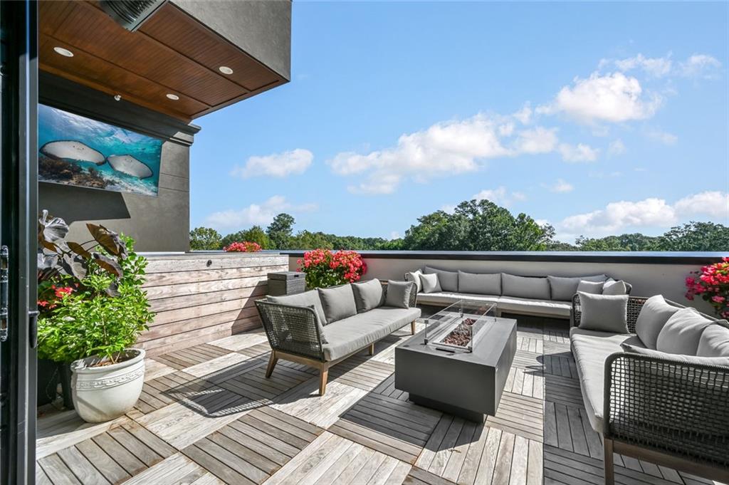 8200 Main Street, Unit 1306 Woodstock, GA 30188 - Photo 41 of 43 a view of a roof deck with couches