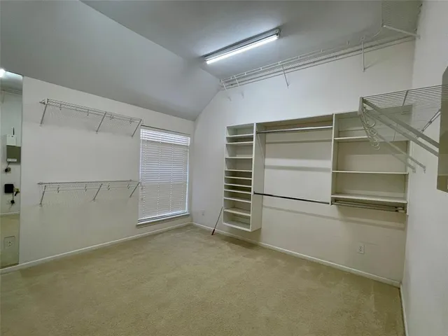 a view of an empty walk in closet