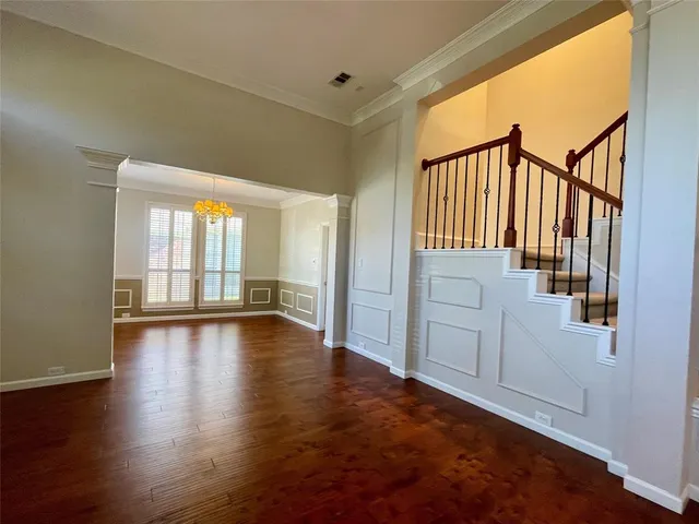 a view of an entryway with wooden floor