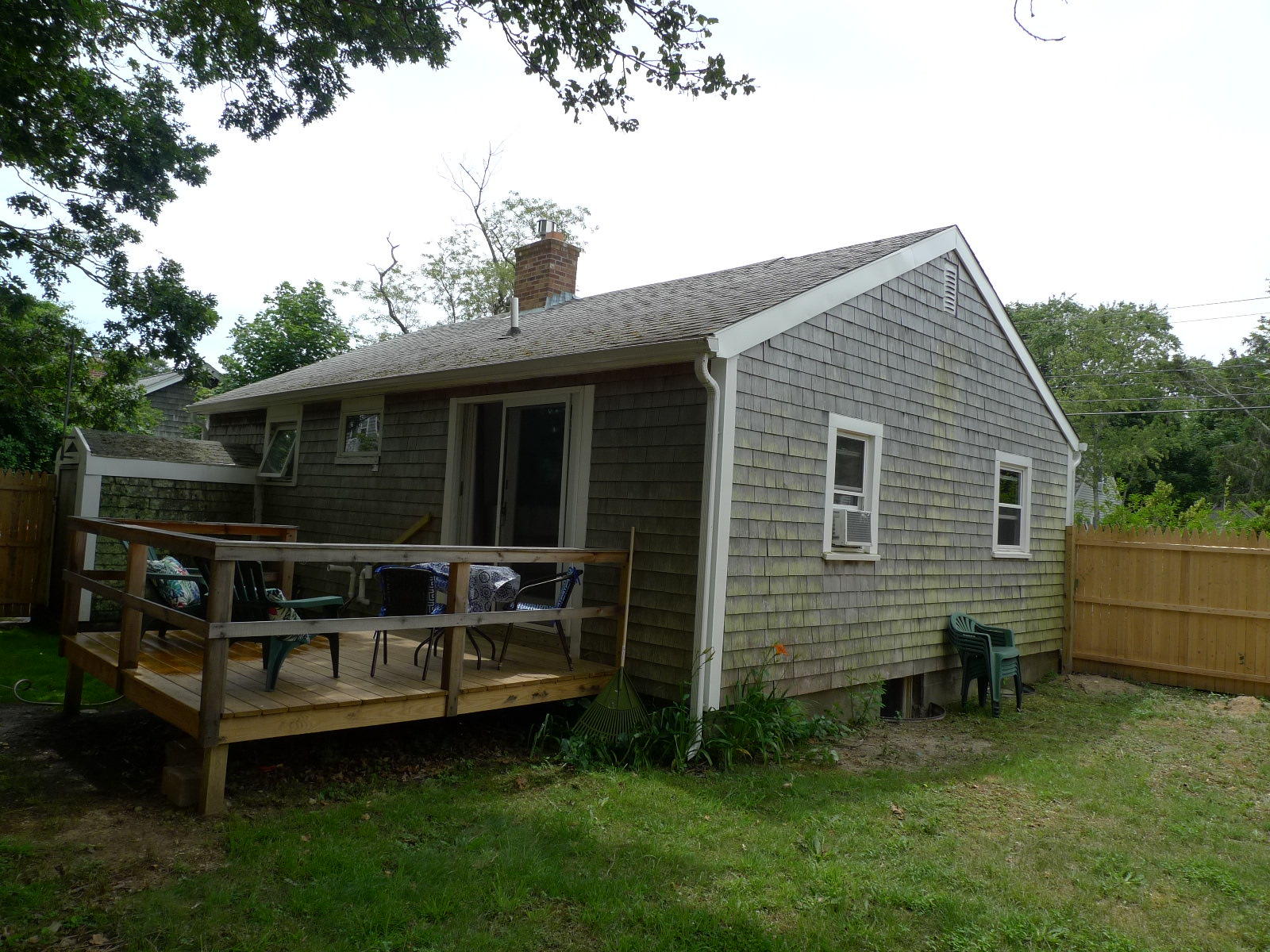 160 Spring Street Hyannis, MA 02601 - Photo 3 of 19 a view of a house with a backyard