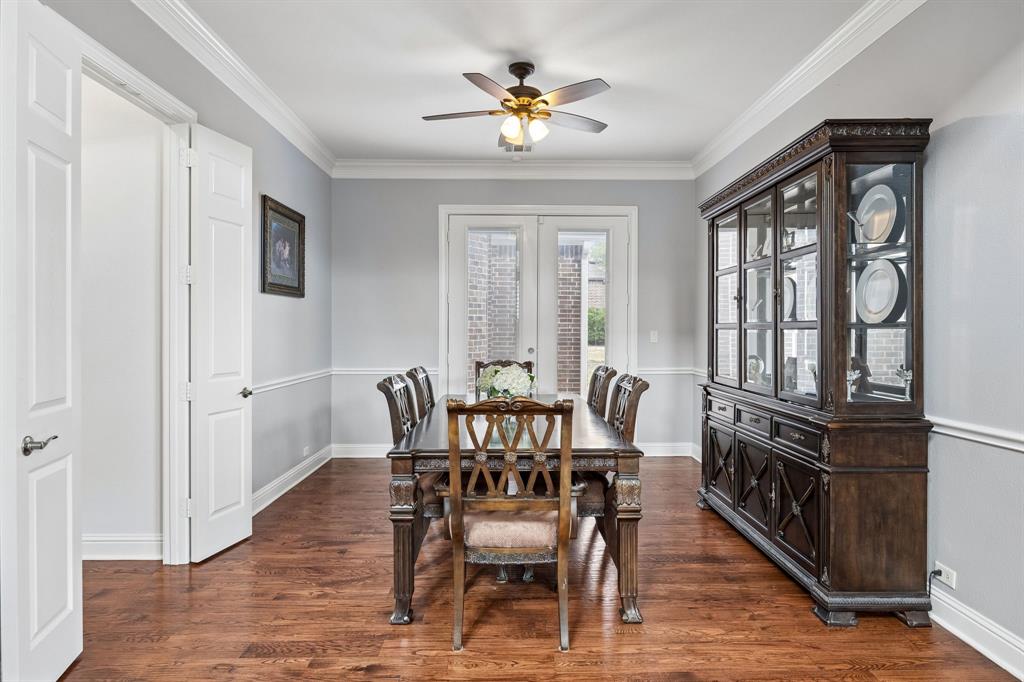 1011 Three Rivers Drive Prosper, TX 75078 - Photo 9 of 27 a view of a dining room with furniture window and wooden floor