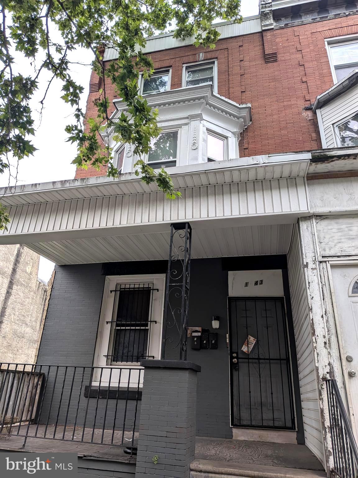 1343 West Pike Street, Unit 3 Philadelphia, PA 19140 - Photo 1 of 10 front view of a house with a balcony