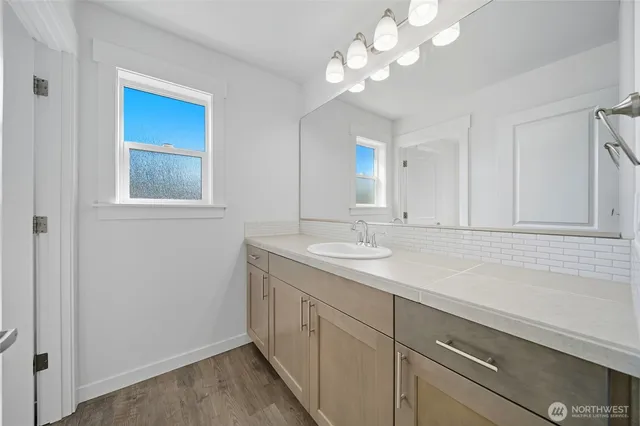 a white toilet sitting next to a bath tub