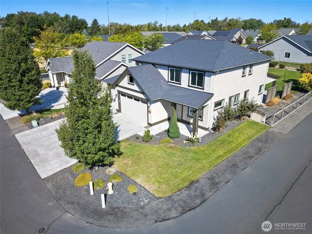 an aerial view of a house with a swimming pool