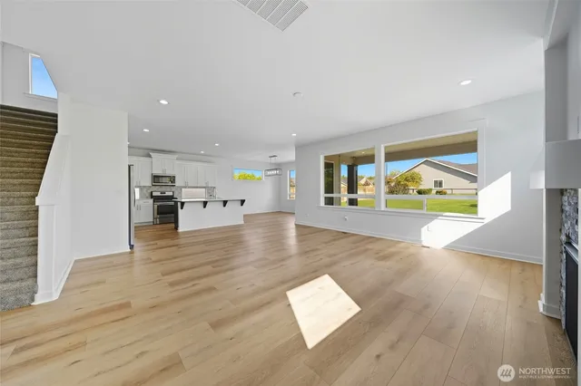a view of kitchen with sink and wooden floor