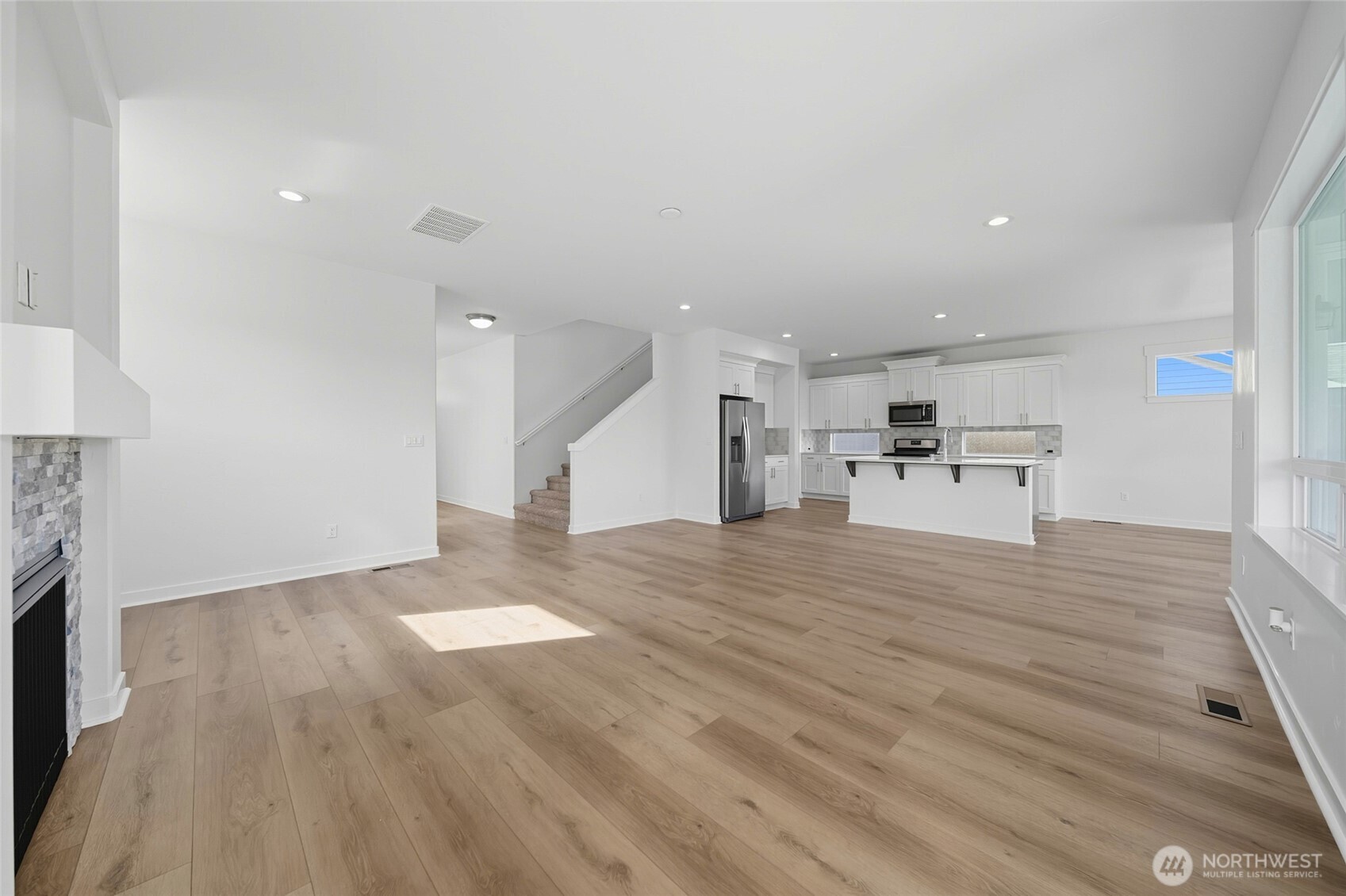 476 Reserve Way Walla Walla, WA 99362 - Photo 7 of 40 a view of a kitchen with a sink and a fireplace