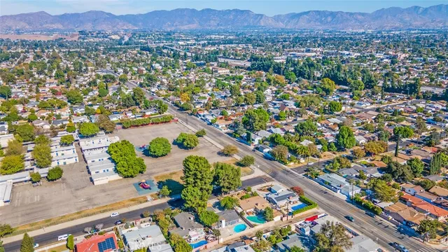 an aerial view of a city and mountain
