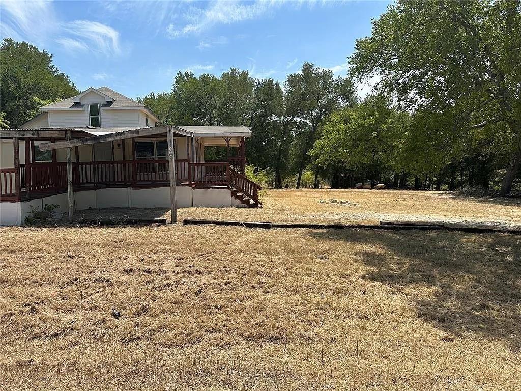 805 Lloyd's Road Little Elm, TX 75068 - Photo 12 of 19 a view of a house with a yard