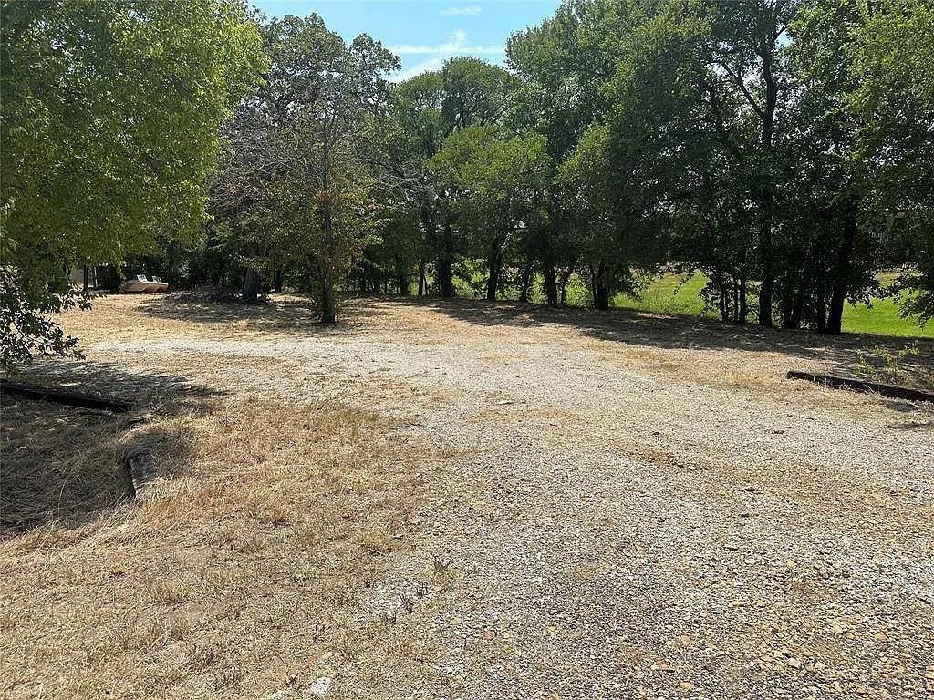 805 Lloyd's Road Little Elm, TX 75068 - Photo 6 of 9 a view of outdoor space with trees