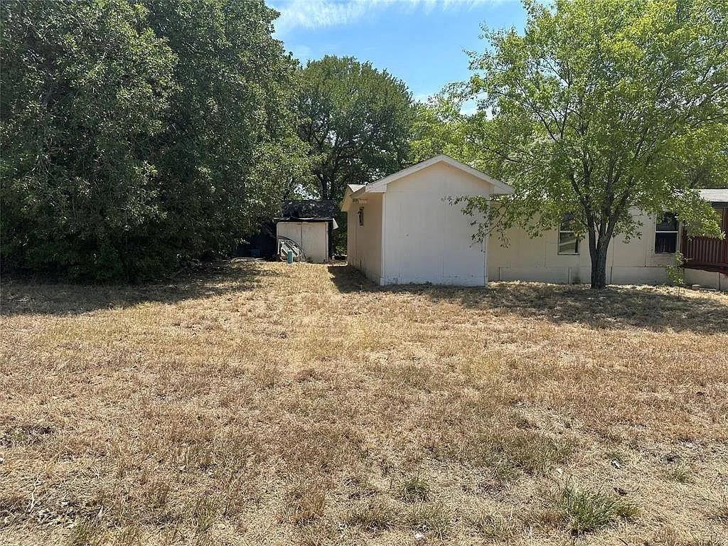 805 Lloyd's Road Little Elm, TX 75068 - Photo 7 of 9 a view of a backyard