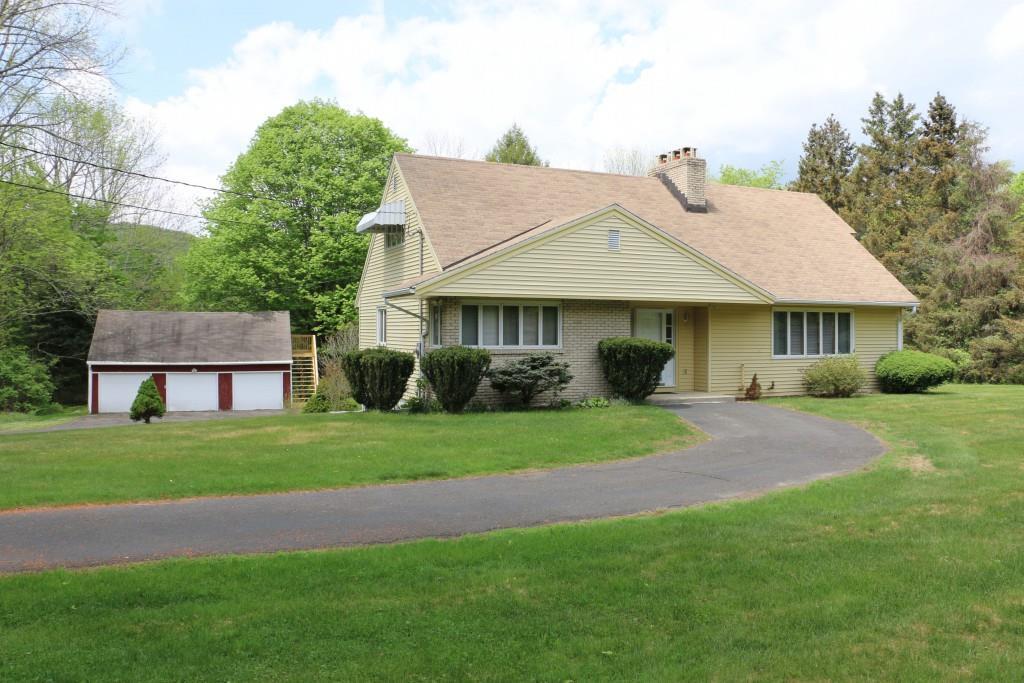 459 Quaker Farms Road Oxford, CT 06478 - Photo 1 of 1 a front view of a house with a garden