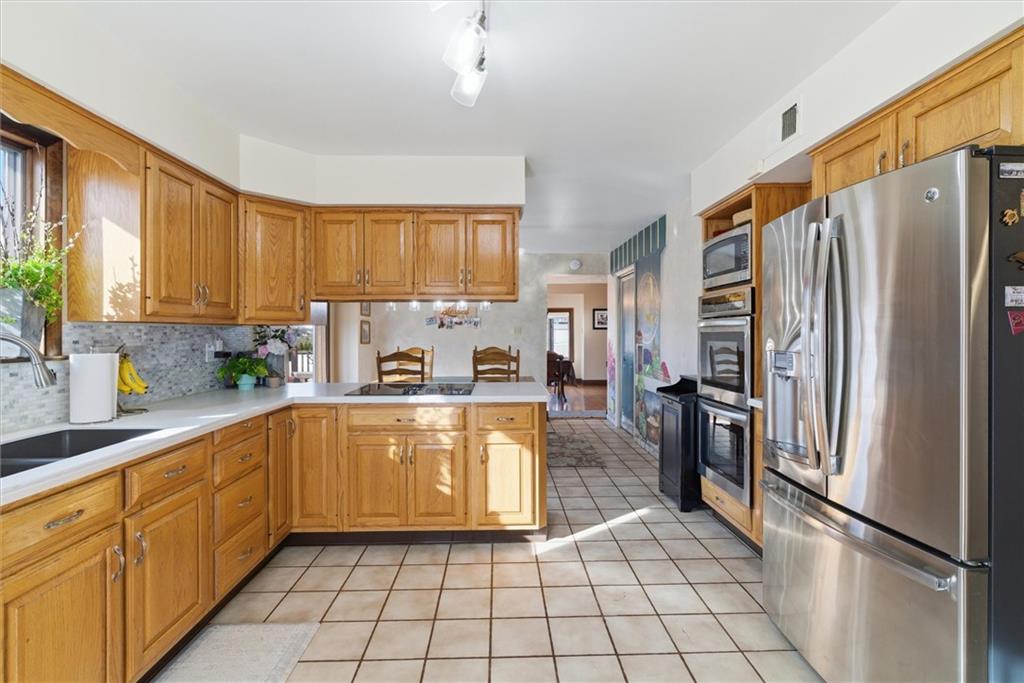 128 Tower Street Monongahela, PA 15063 - Photo 18 of 50 a kitchen with cabinets and stainless steel appliances