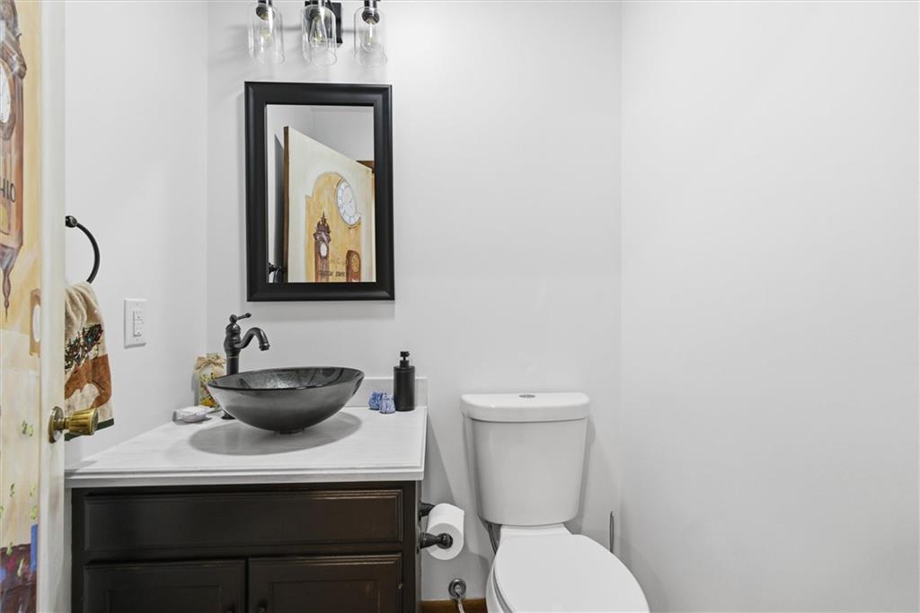 128 Tower Street Monongahela, PA 15063 - Photo 26 of 50 a bathroom with a toilet a sink and mirror