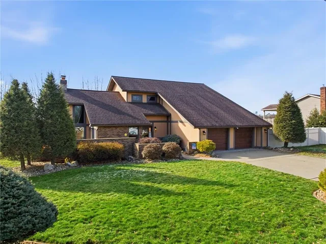 front view of a house with a yard