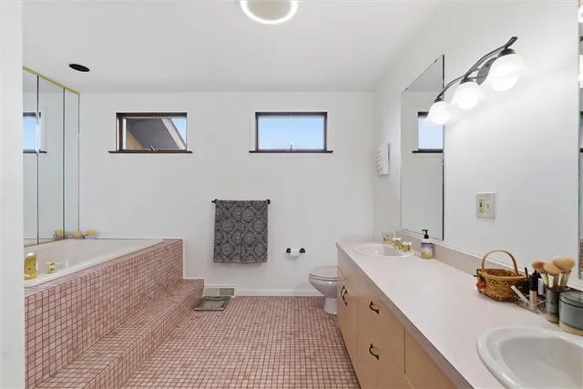a bathroom with a bathtub and shower