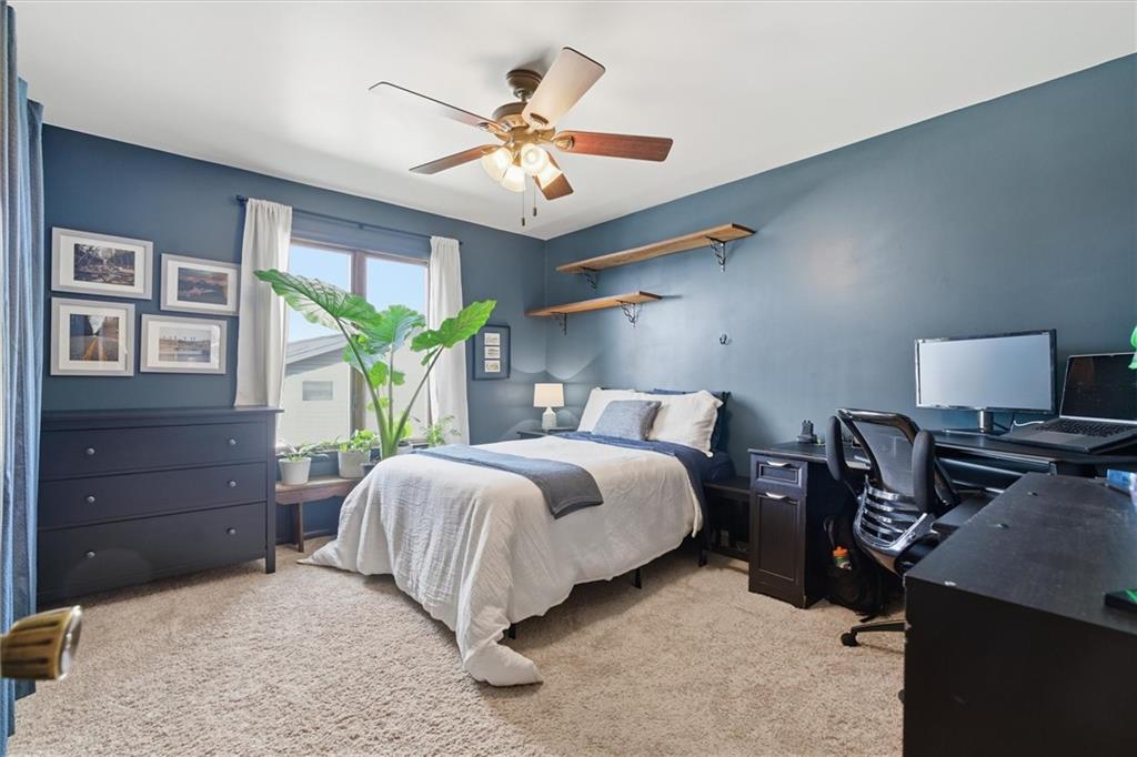 128 Tower Street Monongahela, PA 15063 - Photo 35 of 50 a bedroom with a bed and a chandelier