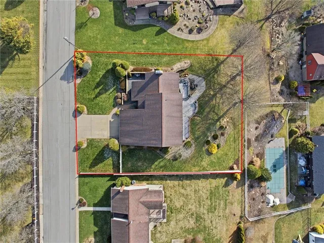 an aerial view of houses with outdoor space