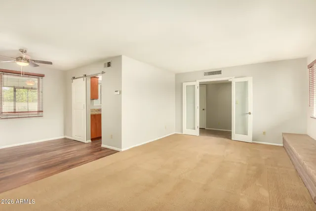 a view of an empty room with a window