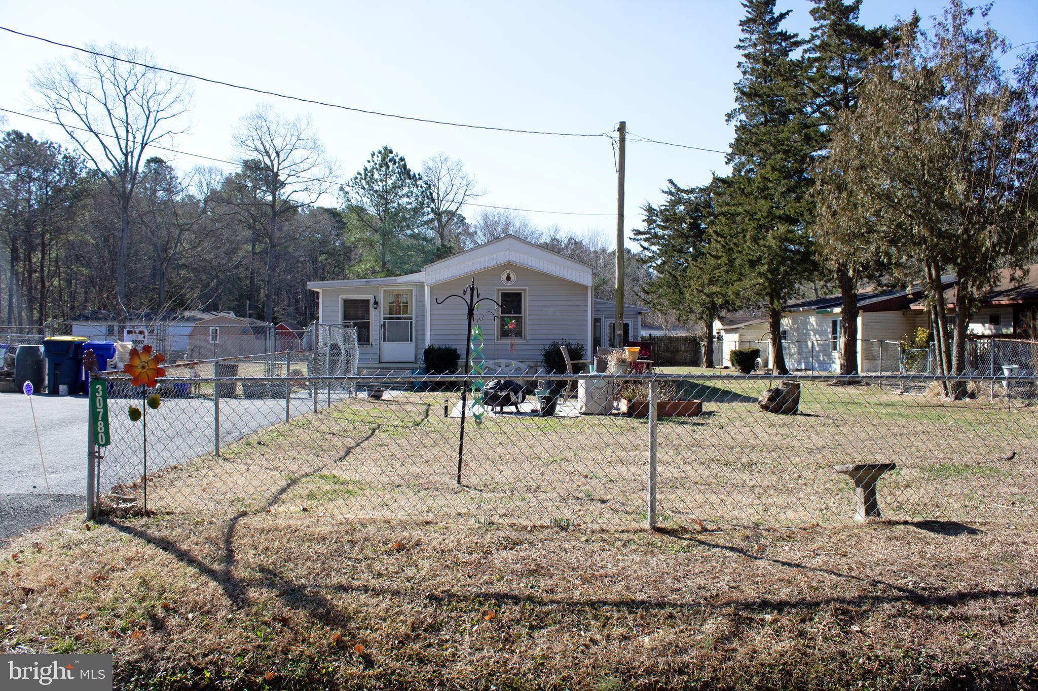 30780 Friendship Road Millsboro, DE 19966 - Photo 2 of 8 a view of a house with a patio