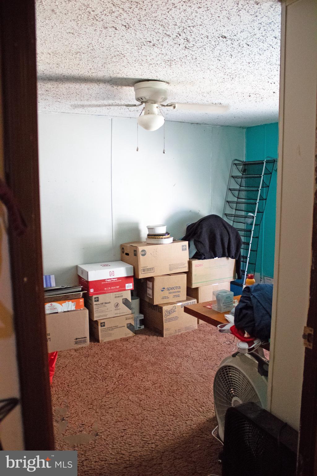 30780 Friendship Road Millsboro, DE 19966 - Photo 5 of 8 a bedroom with furniture and a chair