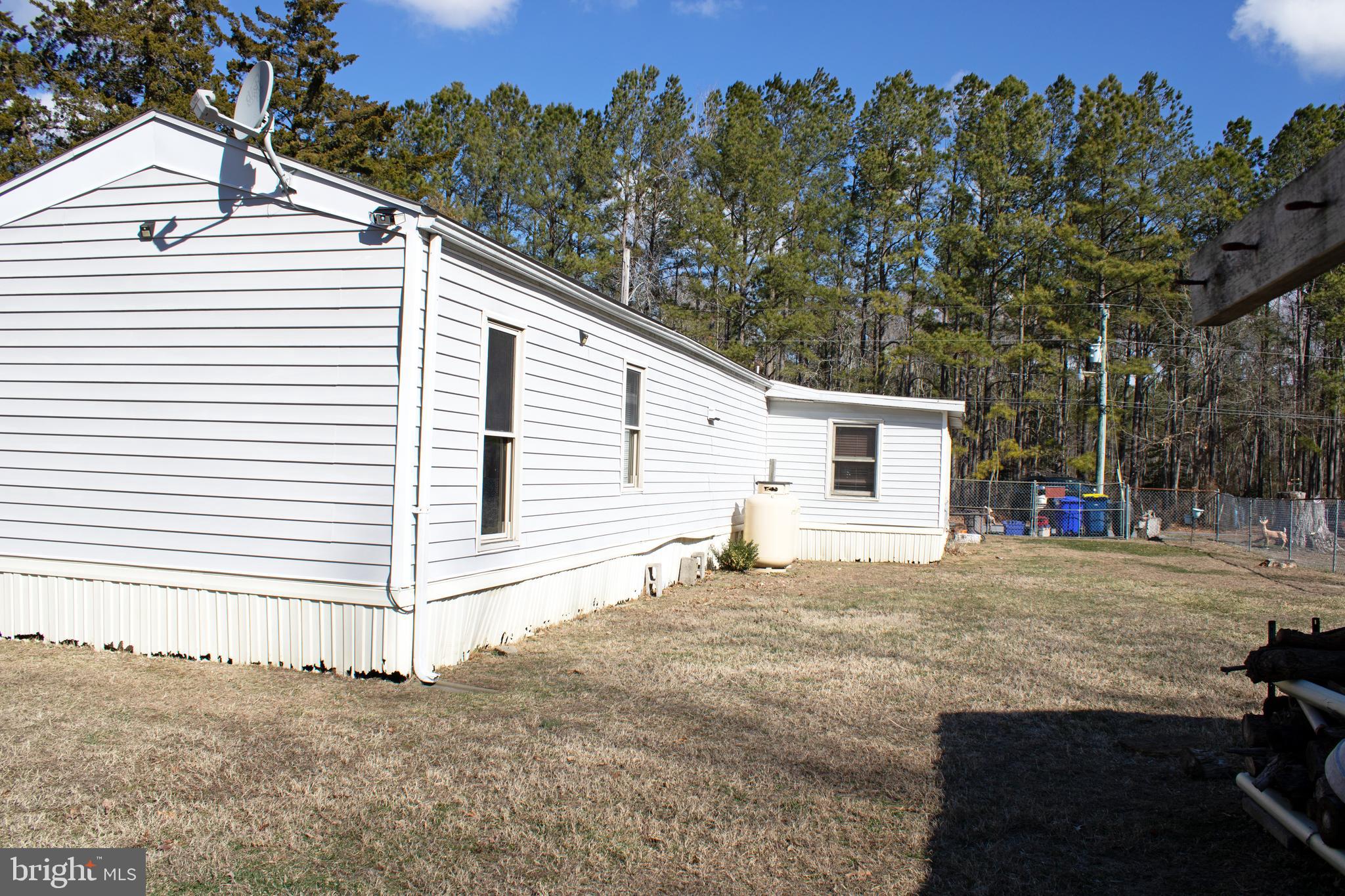 30780 Friendship Road Millsboro, DE 19966 - Photo 7 of 8 a view of a house with a backyard