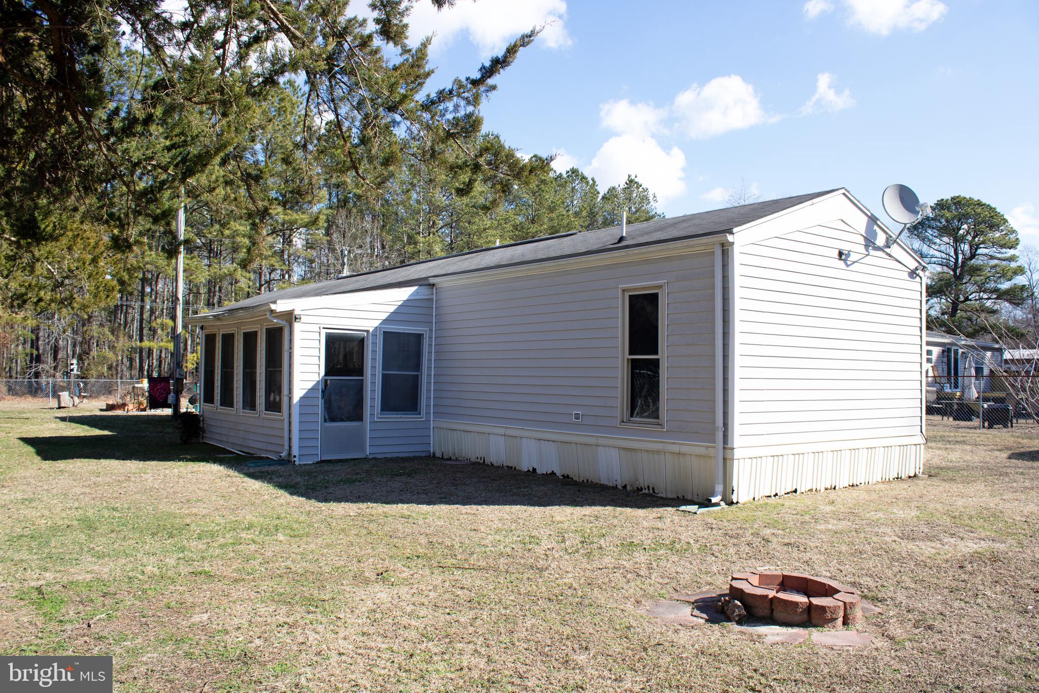 30780 Friendship Road Millsboro, DE 19966 - Photo 8 of 8 a front view of a house with a yard