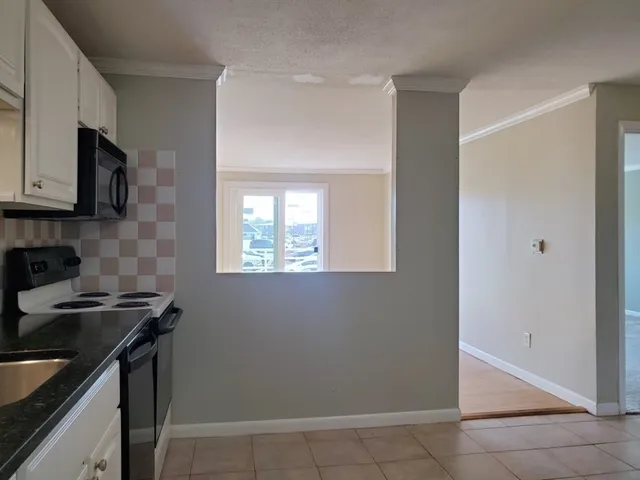a kitchen that has a sink and a stove