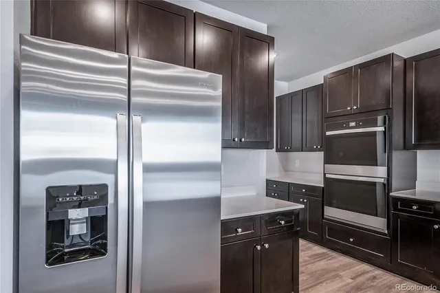 a kitchen with a refrigerator and a refrigerator