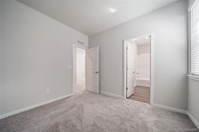 an empty room with closet area