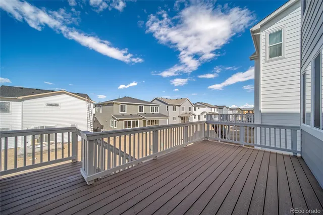 a view of a balcony with wooden floor