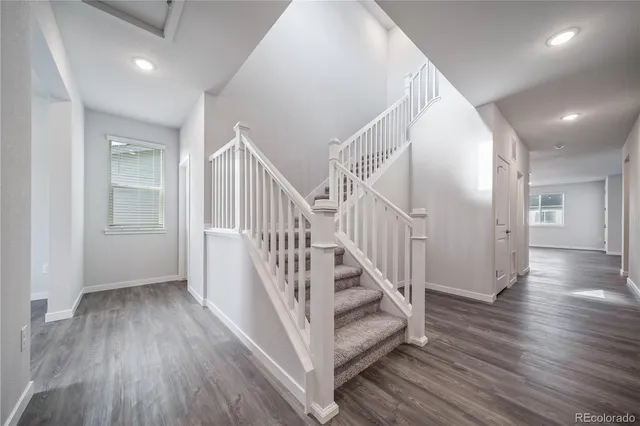 a view of entryway with wooden floor