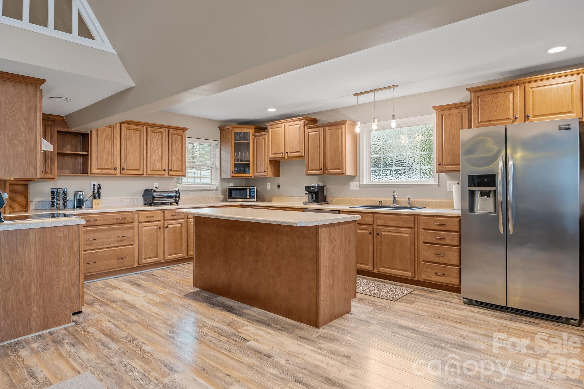 1870 Scout Road Salisbury, NC 28146 - Photo 21 of 48 a kitchen with granite countertop a refrigerator cabinets and wooden floor