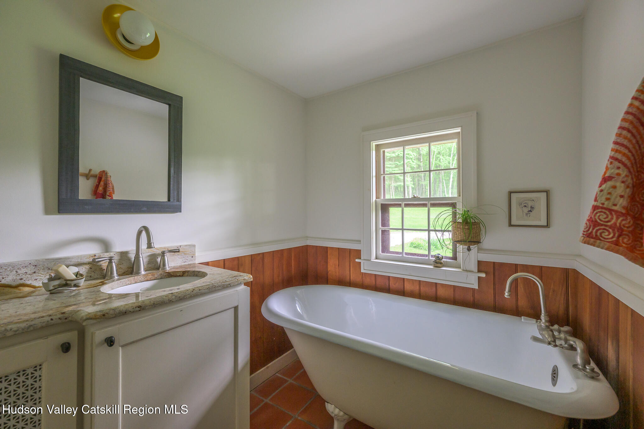 1963 County Rte 5 Canaan, NY 12029 - Photo 26 of 46 a bathroom with a granite countertop tub a sink and mirror